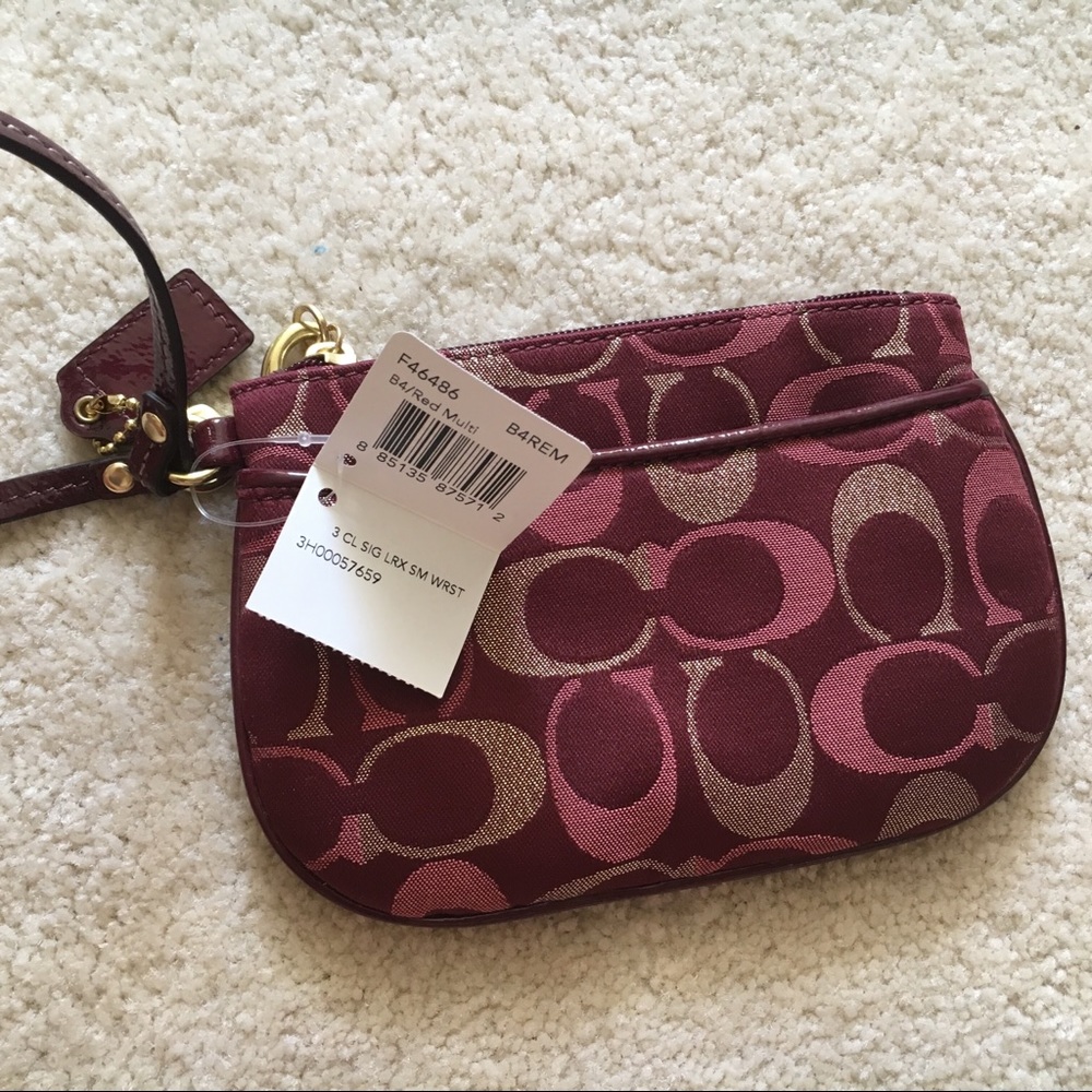 SOLD Coach red gold wristlet